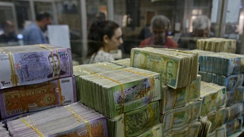 AFP 20221110 32NA743 v1 HighRes SyriaConflictEconomyBank