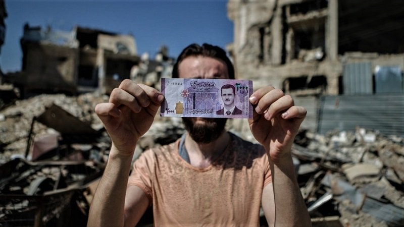 الاقتصاد السوري.. ديون مليارية واحتياطي بـ200 مليون دولار 2 download 1 3